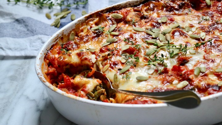Vegetarian lasagna with halloumi, spinach and pumpkin seeds