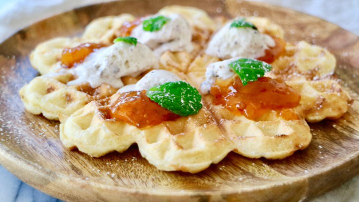 Waffle with cloudberry, ice cream and mint