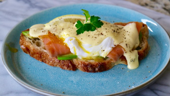Eggs Benedict with salmon and avocado