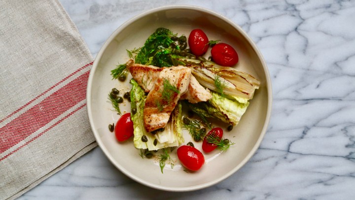 Grilled Snapper fillet with grilled little Gem lettuce, tomatoes and capers