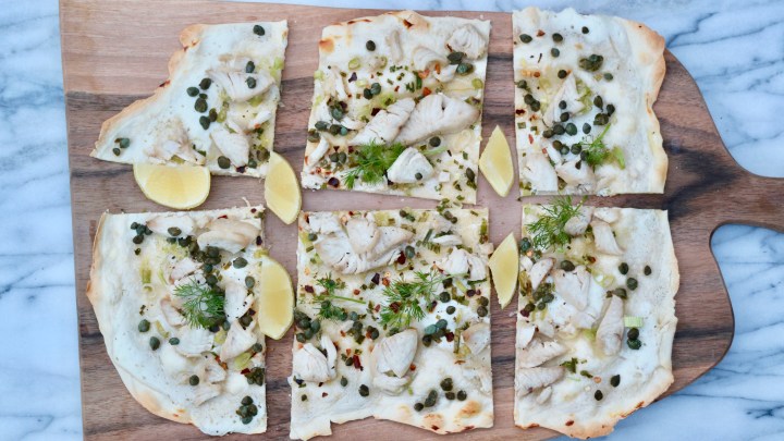 Flammkuchen with chili fish, green onion and capers