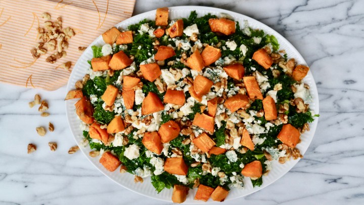 Kale salad with roasted sweet potato, walnuts and blue cheese