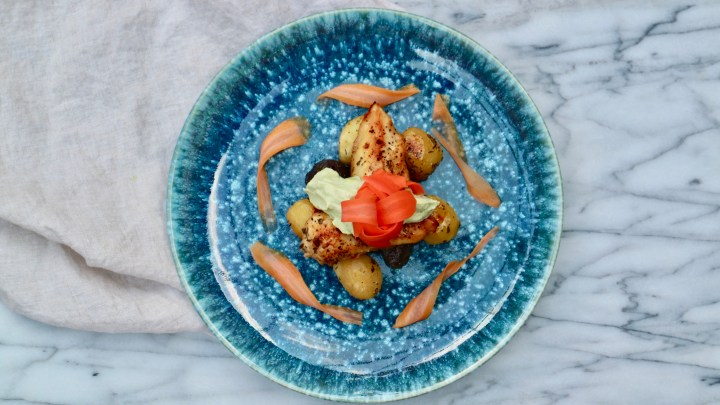 Grilled chicken with roasted potatoes, avocado crema and pickled carrots