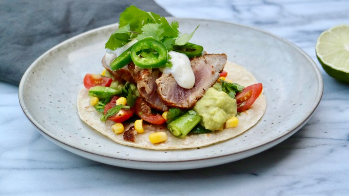 Fish taco with grilled tuna, tomato salad and lime aioli