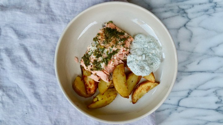 Dill salmon with potato wedges and a creamy pickle and dill sauce