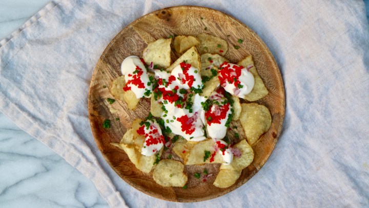 Salty appetizer with sour cream, caviar and chive