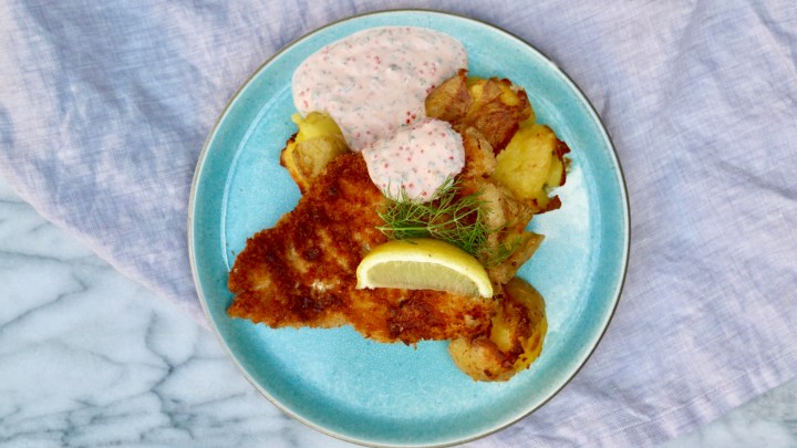Fried cod with crispy smashed potatoes and creamy caviar sauce